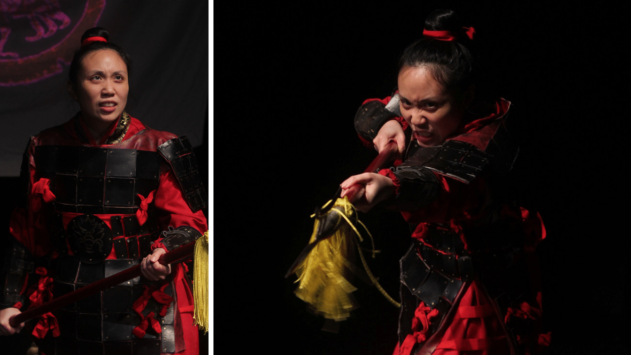 Performer in costume as Mulan wielding a spear